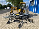 Berger Kraus BK1250JSR mini excavator on trailer with attachments