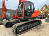 2023 Doosan DX225LC-9C crawler excavator, front three-quarter view
