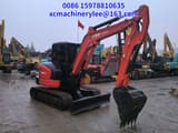 2024 Kubota KX057-4 mini excavator, side view