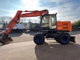 2011 Hitachi Zaxis 140W wheel excavator, side view