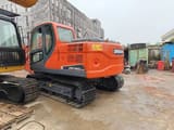 2023 Doosan DX140LC-9C excavator rear three-quarter view