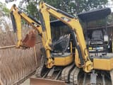 2018 Caterpillar 302C mini excavator, front three-quarter view