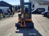 Kubota XE27E mini excavator, front view