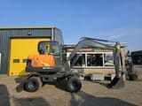 2024 Develon DX60WN ECO-1 wheel excavator side view