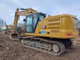 2024 Caterpillar 323-07 crawler excavator, rear three-quarter view