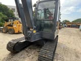 2024 Volvo EC55D mini excavator, rear three-quarter view