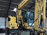 2018 Komatsu PW148-11 wheel excavator, front three-quarter view