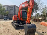 2024 Doosan DX75-9C mini excavator, front three-quarter view