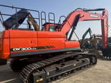 2023 Doosan DX300LCA crawler excavator, rear three-quarter view