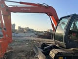 Hitachi ZX55 mini excavator, side profile view