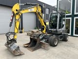 2023 Wacker Neuson EW65 wheel excavator, front three-quarter view
