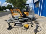 Berger Kraus BK1300JSR mini excavator on trailer with attachments