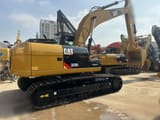 2023 Caterpillar 323DL crawler excavator, rear three-quarter view