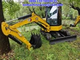 2024 Caterpillar 303.5E mini excavator, side view