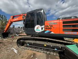 Hitachi Zaxis 200 crawler excavator side view