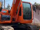 2023 Doosan DX140LC crawler excavator, front three-quarter view