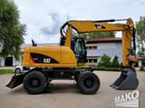 2016 Caterpillar M313D wheel excavator side view