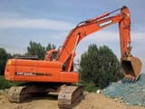 2022 Doosan DX225LC crawler excavator, rear three-quarter view