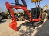 2024 Kubota U55-4 mini excavator, front three-quarter view