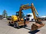 2011 Komatsu PW118 MR-8 wheel excavator, front three-quarter view