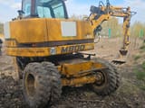 2002 Hydrema M800 wheel excavator, rear three-quarter view