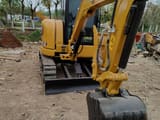 2023 Caterpillar 303.5E mini excavator, front three-quarter view
