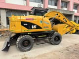 2023 Caterpillar M315D2 wheel excavator, rear three-quarter view