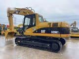 Гусеничний екскаватор 2010 Caterpillar 320CL, вигляд збоку