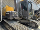 2023 Volvo EC140 crawler excavator, side view of cab and upper structure