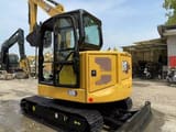 2024 Caterpillar 306 mini excavator, rear three-quarter view