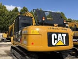 2024 Caterpillar KAT320D excavator, rear three-quarter view