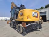 2024 Caterpillar MH3024 wheel excavator, rear three-quarter view