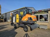 2024 Develon DX60WN ECO-1 wheel excavator, front three-quarter view
