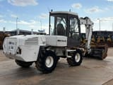 2013 Mecalac 12MTX wheel excavator, rear three-quarter view