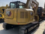 Caterpillar 308E2 mini excavator, rear three-quarter view
