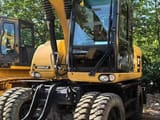 2019 Caterpillar M315D2 wheel excavator, front three-quarter view