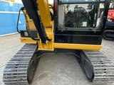 2024 Caterpillar 306E2 mini excavator, close-up of cab and tracks