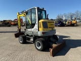 2019 Wacker Neuson EW65 wheel excavator, rear three-quarter view