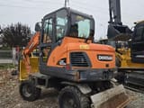 2018 Doosan DX60W wheel excavator, rear three-quarter view