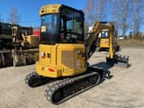 2023 Caterpillar 303CR mini excavator, rear three-quarter view