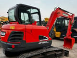 2023 Doosan DX60-9C mini excavator, rear three-quarter view