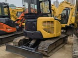 2022 Komatsu PC-55MR mini excavator rear three-quarter view