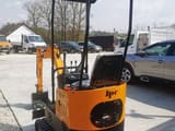 2026 JCB JPC HT12 mini excavator, rear three-quarter view