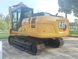 2025 Caterpillar 320GX crawler excavator, rear three-quarter view