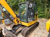 2021 Caterpillar 306CR mini excavator, side view of cab and boom