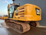 2019 Caterpillar 323 crawler excavator, rear three-quarter view