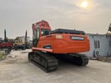 2023 Doosan DX225.LCA crawler excavator, rear three-quarter view