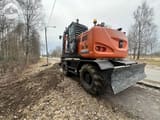2018 Hitachi Zaxis 140W wheel excavator, rear three-quarter view