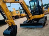 2024 Caterpillar 304 mini excavator, front three-quarter view