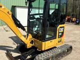 2019 Caterpillar 302 NG mini excavator, side view